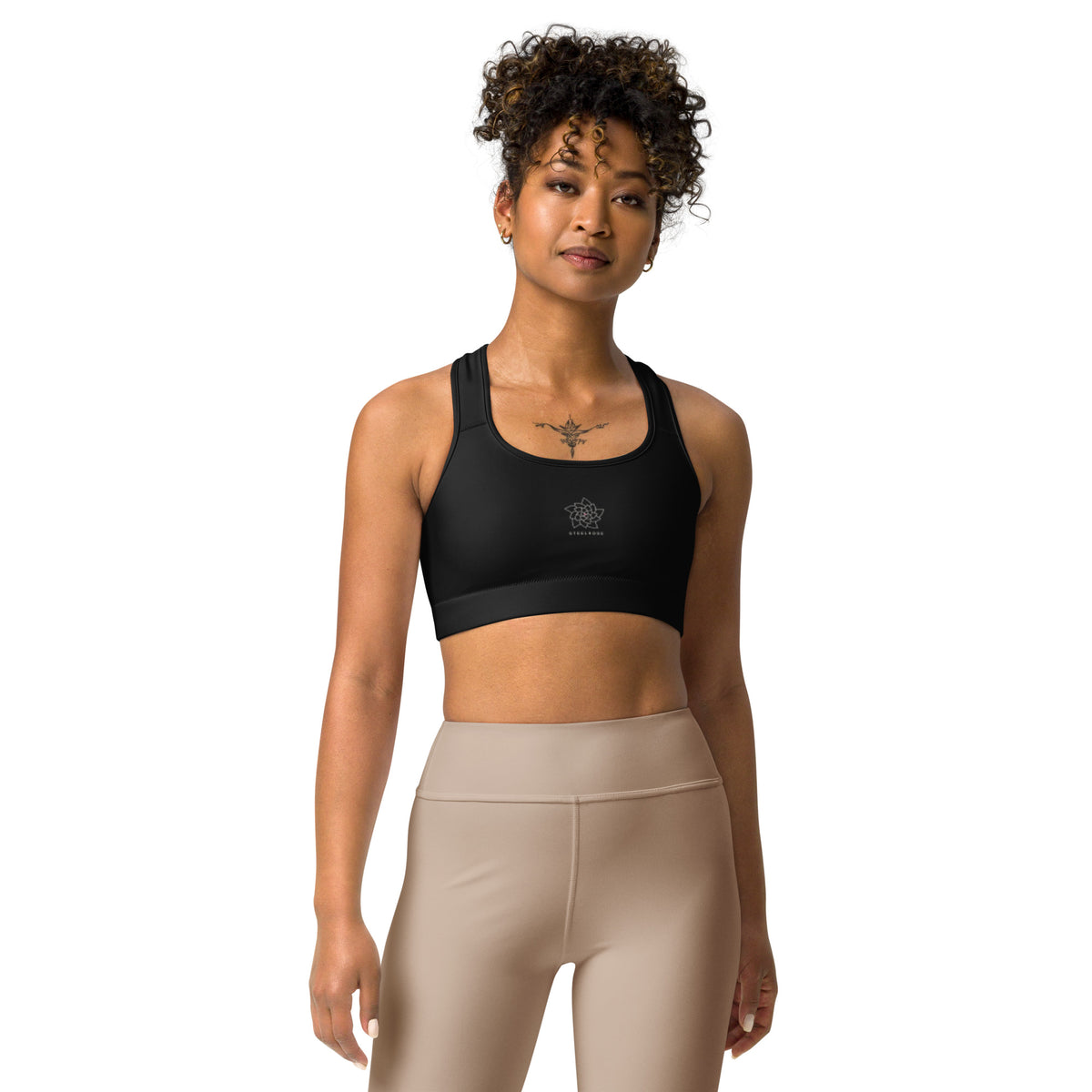 STEELROSE Rose Crest Sports Bra in black, worn with neutral leggings