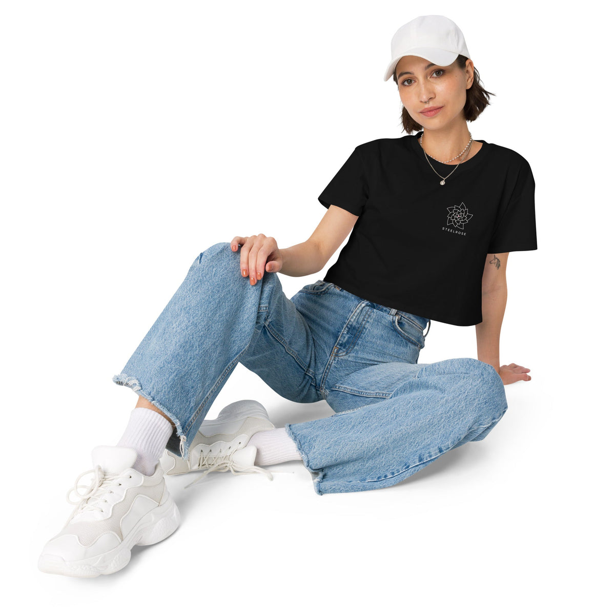 Woman wearing the STEELROSE Signature Crop Tee in black, relaxed styling